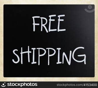 ""Free shipping" handwritten with white chalk on a blackboard"