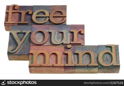 free your mind - relaxation or meditation concept - words in vintage wooden letterpress printing blocks, stained by color inks, isolated on white
