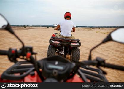 Freedom atv riding in desert sands, racer eyes view. Male persons on quad bikes, sandy race, dune safari in hot sunny day, 4x4 extreme adventure, quad-biking. Freedom atv riding in desert, racer eyes view