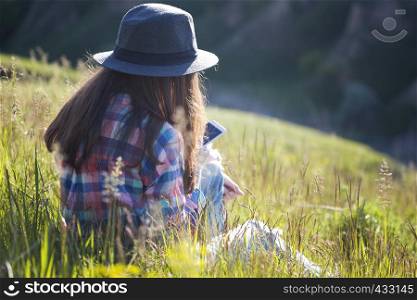 freedom - beautiful teen girl on the nature with smartphone