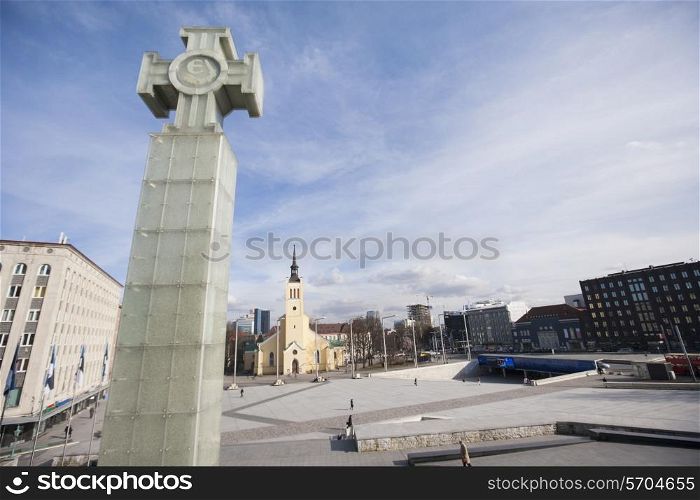Freedom monument with St. John&rsquo;s Church at freedom square; Tallinn; Estonia; Europe