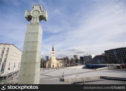 Freedom monument with St. John&rsquo;s Church at freedom square; Tallinn; Estonia; Europe