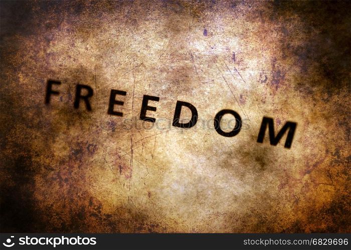 Freedom text on grunge background