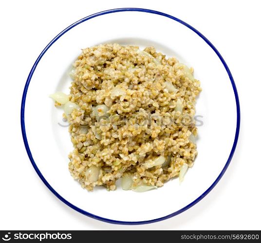 "Freekeh, fire-dried green wheat, cooked with pearl onions and stock, seen from above. The grain is being hailed as a "paleo" "superfood" by health gurus. It has a lower glycemic index than most grains and is high in fibre (three times as much as brown rice), protein and minerals. One of man&rsquo;s oldest cereal foods, it is still popular in the middle east."