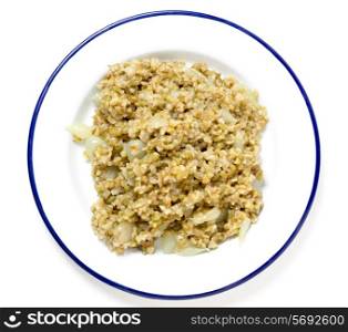 "Freekeh, fire-dried green wheat, cooked with pearl onions and stock, seen from above. The grain is being hailed as a "paleo" "superfood" by health gurus. It has a lower glycemic index than most grains and is high in fibre (three times as much as brown rice), protein and minerals. One of man&rsquo;s oldest cereal foods, it is still popular in the middle east."