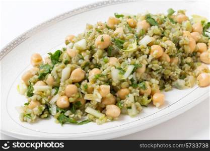 Freekeh salad with chickpeas, onion, parsley, celery, and a lemon juice and olive oil dressing