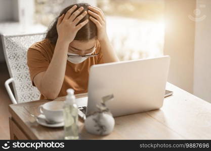 freelance people business female wearing protective mask casual and writing message on smartphone working with laptop computer ,working from home,Concept of Prevention of the spread of COVID-19 virus