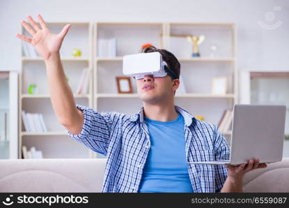 Freelance student with virtual reality glasses at home