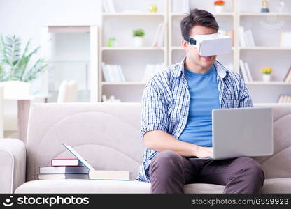 Freelance student with virtual reality glasses at home