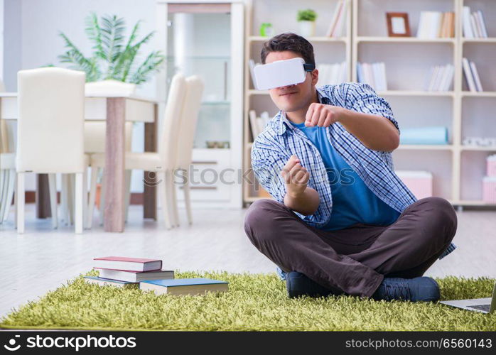 Freelance student with virtual reality glasses at home