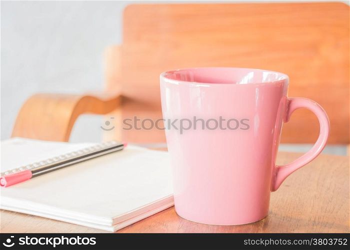 Freelance work table with notepaper and coffee, stock photo