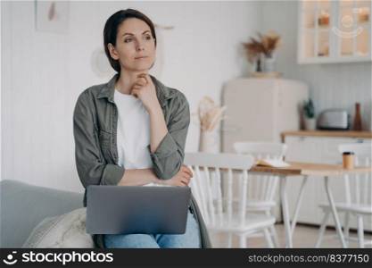 Freelancer is dreaming. European woman is sitting in front of computer at home and relaxing. Businesswoman working on startup. Remote work, success and inspiration on quarantine.. Freelancer is dreaming sitting in front of computer. Remote work, success and inspiration.
