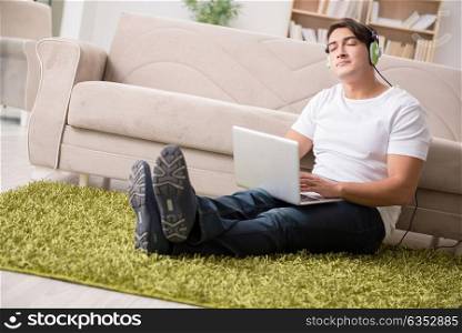 Freelancer working at home and listening to music