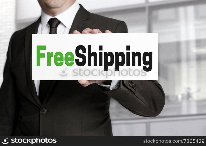 freeshipping sign is held by businessman.. freeshipping sign is held by businessman