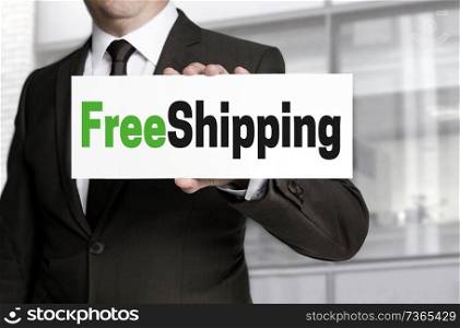 freeshipping sign is held by businessman.. freeshipping sign is held by businessman