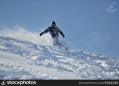 freestyle snowboarder jump and ride free style at sunny winter day on mountain