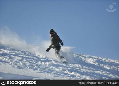 freestyle snowboarder jump and ride free style at sunny winter day on mountain