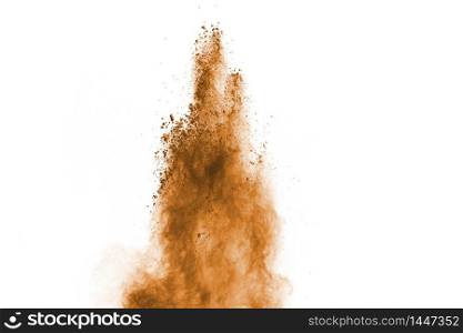Freeze motion of brown color powder exploding on white background.