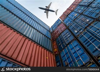 Freight airplane flying above overseas shipping container . Logistics supply chain management and international goods export concept .. Freight airplane flying above overseas shipping container