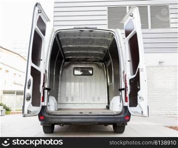 freight transportation, logistics, transport and vehicle concept - white empty minivan car with open doors on city parking