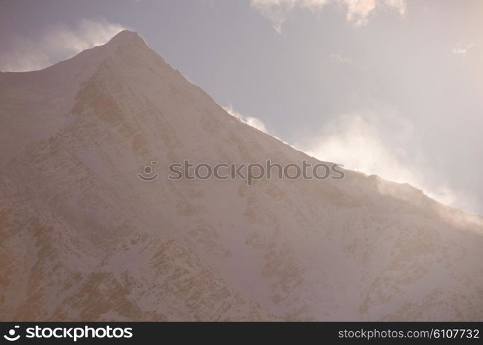 French alps mountain peaks covered with fresh snow. Winter landscape nature scene on beautiful sunny winter day.