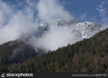 French alps mountain peaks covered with fresh snow. Winter landscape nature scene on beautiful sunny winter day.