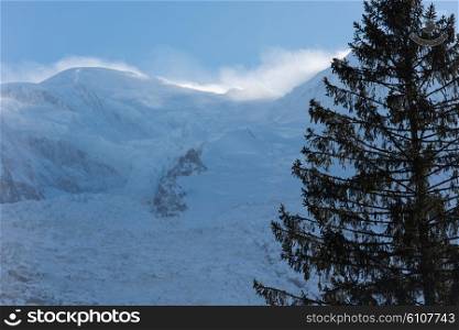 French alps mountain peaks covered with fresh snow. Winter landscape nature scene on beautiful sunny winter day.