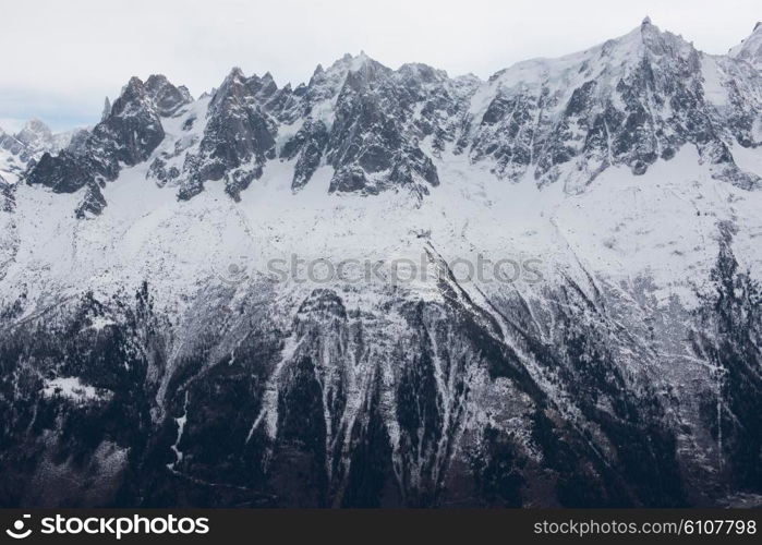 French alps mountain peaks covered with fresh snow. Winter landscape nature scene on beautiful sunny winter day.