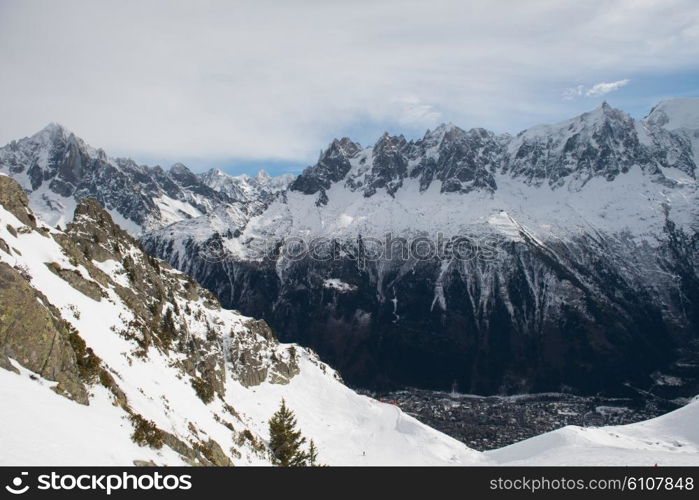 French alps mountain peaks covered with fresh snow. Winter landscape nature scene on beautiful sunny winter day.