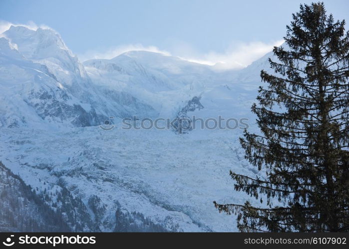 French alps mountain peaks covered with fresh snow. Winter landscape nature scene on beautiful sunny winter day.