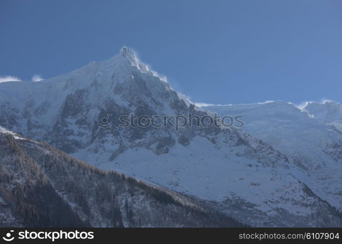 French alps mountain peaks covered with fresh snow. Winter landscape nature scene on beautiful sunny winter day.