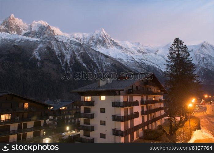 French alps mountain peaks covered with fresh snow. Winter landscape nature scene on night.