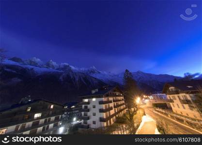 French alps mountain peaks covered with fresh snow. Winter landscape nature scene on night.