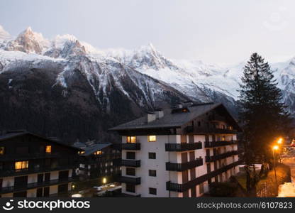 French alps mountain peaks covered with fresh snow. Winter landscape nature scene on night.