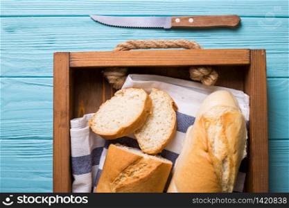 french baguettes on wooden blue background