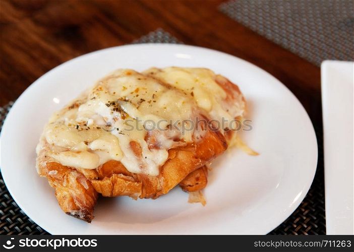 French baked pastry beautiful warm cheese croissant on white plate