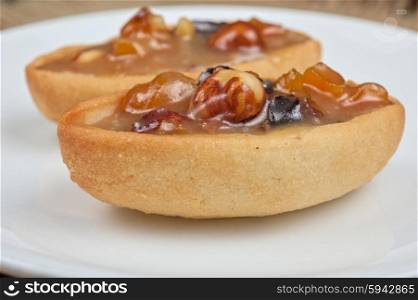 French basket sweet cakes . French basket sweet cakes with chocolate and nuts closeup photo