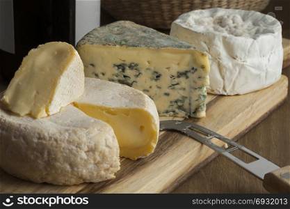 French cheese platter with variety of different cheeses for dessert