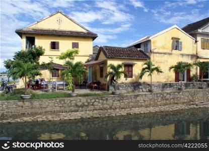 French colonial buildings on the canel in Hoi An, Vietnam