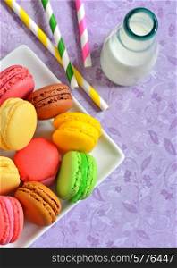 french colorful macarons and milk