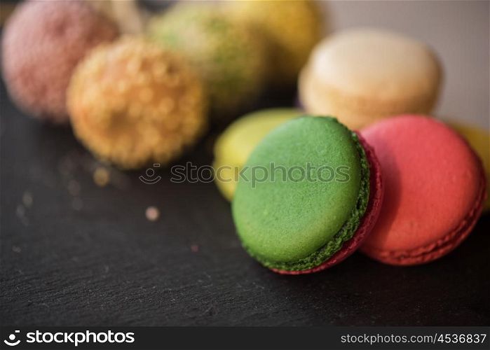 French colorful macarons. French colorful macarons on black background