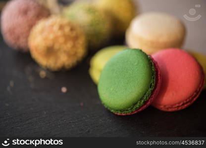 French colorful macarons. French colorful macarons on black background