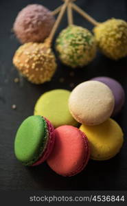 French colorful macarons. French colorful macarons on black background