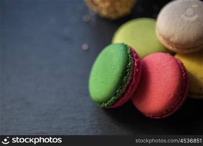 French colorful macarons. French colorful macarons on black background