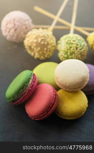 French colorful macarons. French colorful macarons on black background