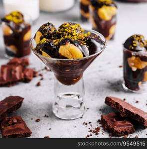 French cuisine, tasty dessert profiteroles with hot chocolate