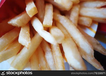 French fries in the box in the restaurant. French fries in the box