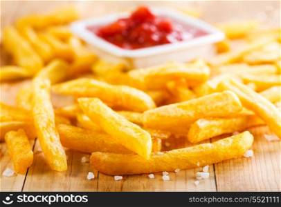 french fries on wooden table