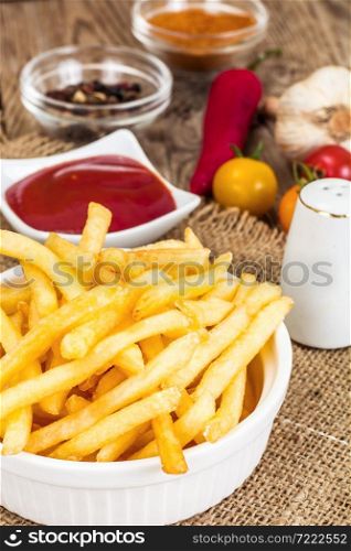 French Fries Potato with Ketchup on Rustic Wooden Background. French Fries Potato with Ketchup