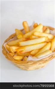 French fries . Traditional French fries in a bamboo basket